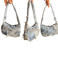 three people holding up a pair of denim purses